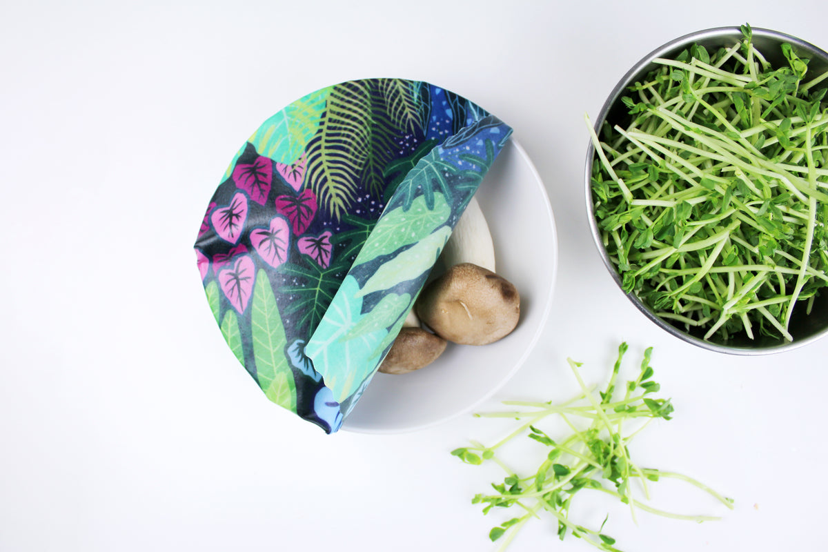 lifestyle image of cloud forest print covering bowl of oyster mushrooms in premium cotton beeswax wraps by em+co art in collaboration with minimakers (local designer) singapore