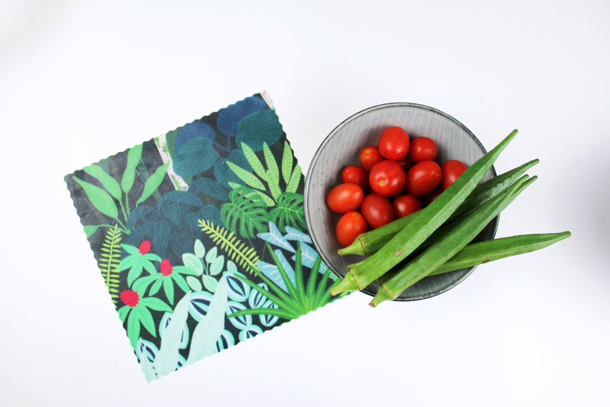 lifestyle image of singapore botanic gardens print wrapping ladyfingers in premium cotton beeswax wraps by em+co art in collaboration with minimakers (local designer) singapore