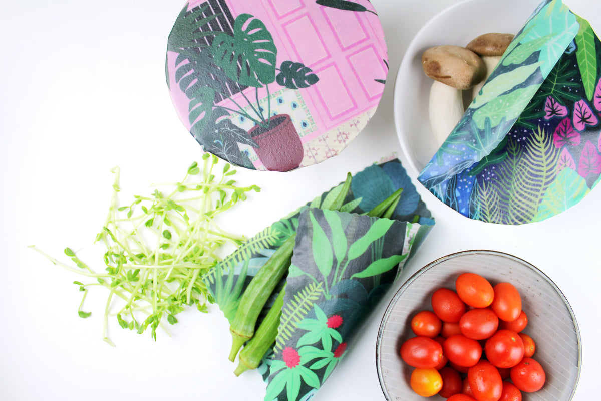 lifestyle image of singapore botanic gardens print keeping vegetables fresh in premium cotton beeswax wraps by em+co art in collaboration with minimakers (local designer) singapore